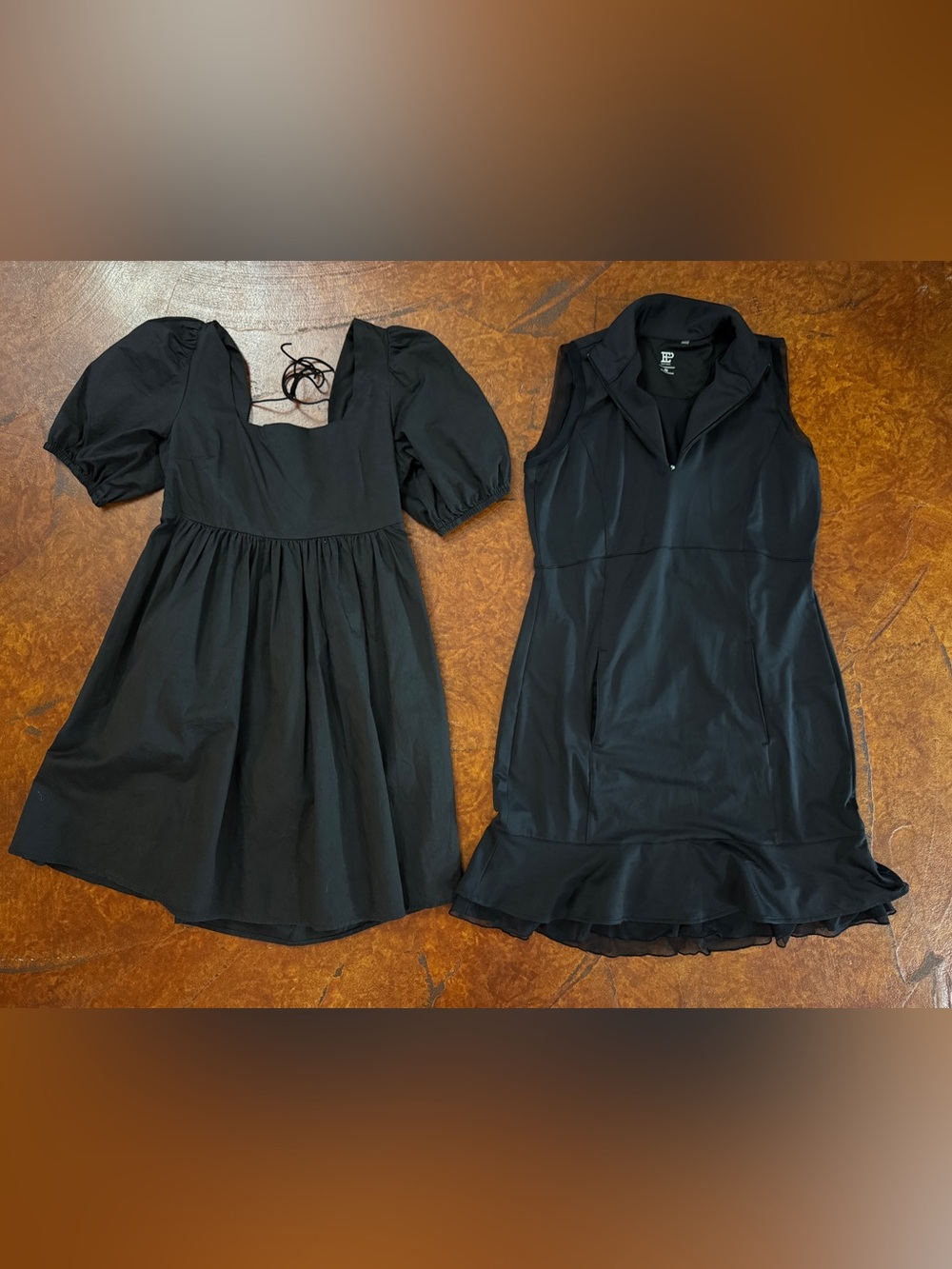 2 cute black dresses, fit as women’s medium. Cute casual/dressy and athletic
